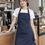 Tạp dề đồng phục màu xanh navy, túi ngực nhỏ, form dạng váy chống nước, chất vải chống thấm
