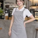Tạp dề đồng phục màu ghi sáng, túi ngực nhỏ, form dạng váy chống nước, chất kaki thun