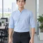 Đồng phục văn phòng màu xanh dương nhạt, cổ áo đứng dáng, form sơ mi tay lỡ, chất kate silk