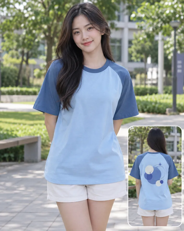 Người mẫu Việt Nam mặc áo lớp thun màu xanh dương nhạt, hình in lớn sau lưng, form tay raglan, chất cotton compact